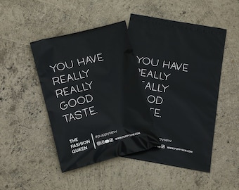 May include: Two black mailing bags with white text that reads "You have really really good taste." and "You have 'eally ally od 'e."