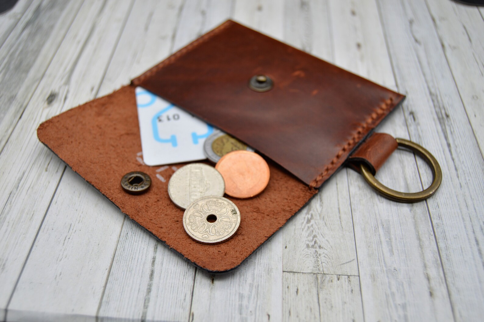 white keychain wallet