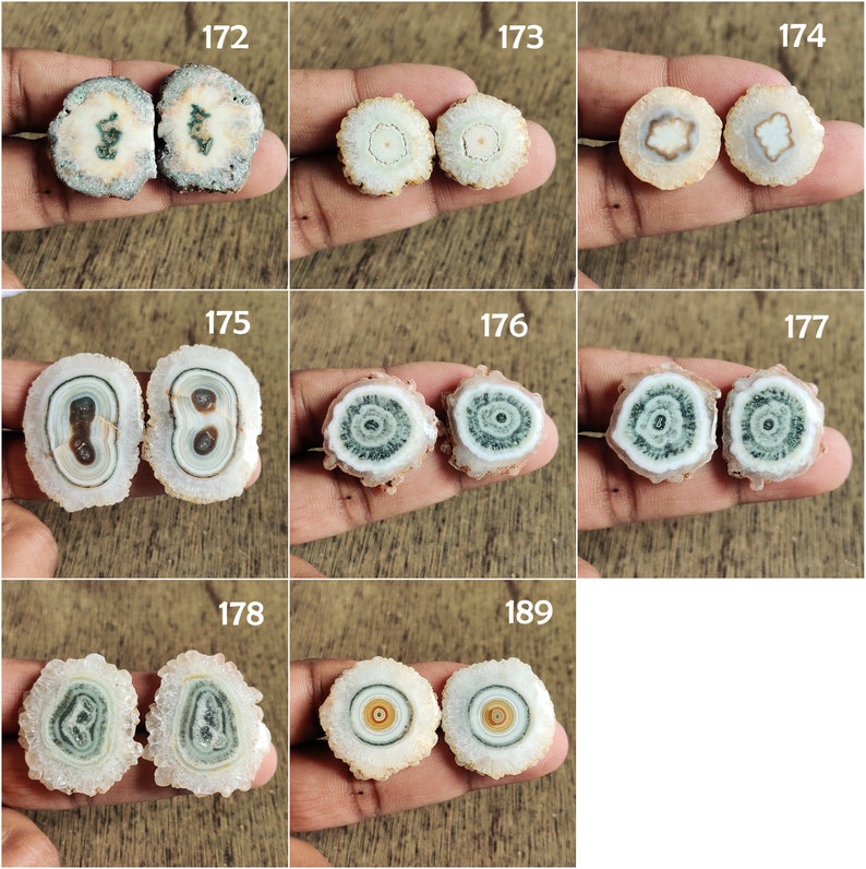 May include: Set of two agate slices with a white, green, and brown pattern. The agate slices are polished and have a smooth surface.