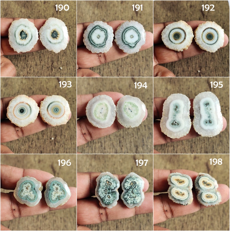 May include: Nine pairs of agate slices with different patterns and colors, including white, green, and brown. The agate slices are arranged in a grid pattern.