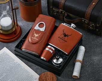 May include: A brown leather gift set with a flask, a cigar case, a shot glass, and a funnel. The flask and cigar case are engraved with the text "Mustar Groomsman".