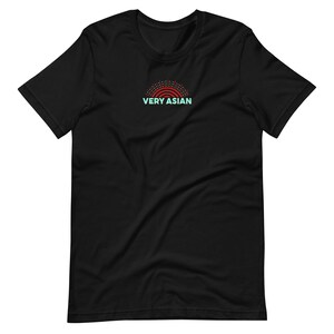 May include: Black t-shirt with a red and teal graphic. The graphic features a stylized rainbow design above the text "VERY ASIAN" in teal. The shirt is made of a soft material and has short sleeves.