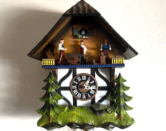 Working! 1971 Vintage “Saw Mill Wood Chopper” chalet cuckoo clock. Moving characters! Made in Germany. 1 year warranty!
