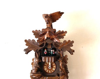 Beautiful vintage, musical, “Woodland Eagle”  cuckoo clock. Hand carved in Germany. Nighttime shut-off. Works great! 1 year warranty!!