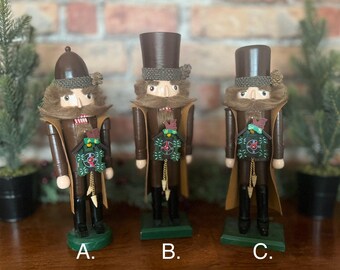 Handmade “Clock Peddler” nutcracker holding a darling wooden cuckoo clock ornament! Unique Christmas gift. So cute! Comes Gift Wrapped!