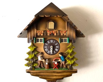 Working! 1982 Vintage “Lumberjack” chalet cuckoo clock. Moving characters! Made in West Germany. 1 year warranty included!