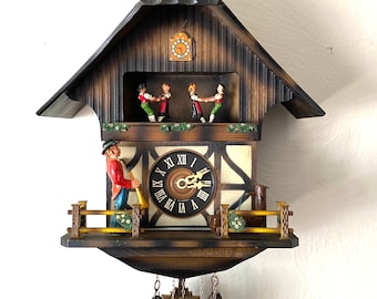 Darling, Vintage, musical “Horn Player” cuckoo clock. Made in West Germany by E. Schmeckenbecher. Moving characters! 1 year warranty!!