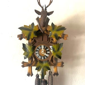 Large, Vintage 2 door Musical “Stag Head” cuckoo clock. Hand carved wood. Works great! Made in West Germany 1970. 1 year warranty included!!