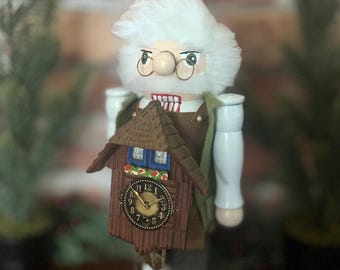Handmade “Clock Doctor” Nutcracker holding a WORKING vintage Chalet style German wind-up novelty cuckoo clock! Perfect Christmas gift!!