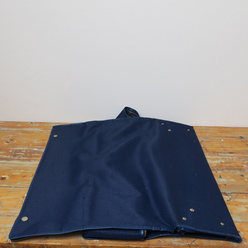 Old suitcasebag of blue cotton.