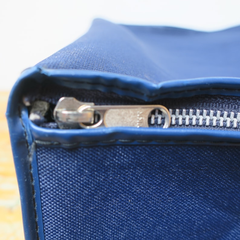 Old suitcasebag of blue cotton.