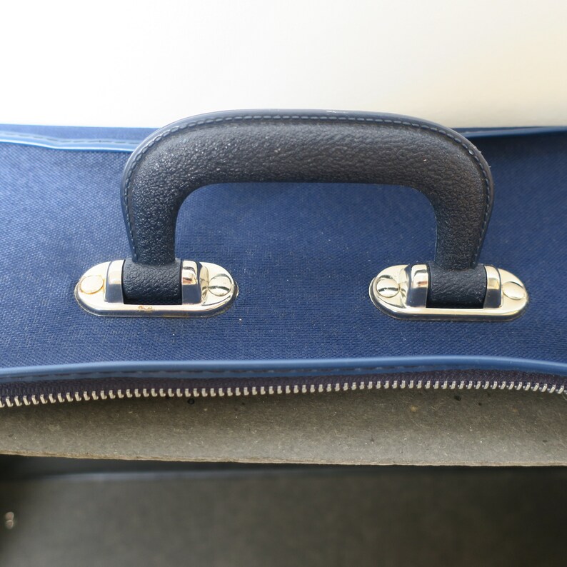 Old suitcasebag of blue cotton.