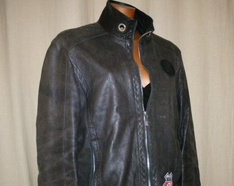May include: A black leather jacket with a zipper closure and a Route 66 patch on the sleeve.