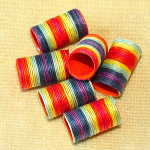 May include: A set of three ceramic mugs with a speckled, matte finish. The mugs are in shades of cream, light gray, and dark gray. Each mug has a simple, minimalist design, perfect for coffee or tea.