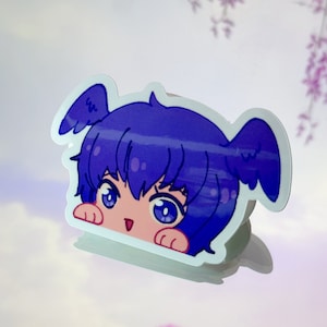 Puede incluir: Una pegatina con un personaje de dibujos animados con el pelo azul y una expresión de sorpresa. El personaje está asomando por detrás de una superficie blanca.