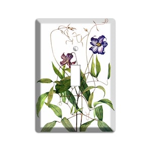 May include: A light switch cover featuring a watercolor illustration of purple and white flowers with green leaves.