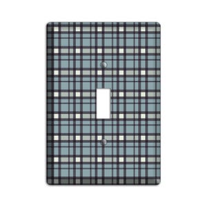 May include: A light blue and white checkered light switch cover with a black border.