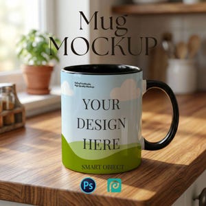 May include: A white mug with a black handle and rim, featuring the text "Mug MOCKUP" and "YOUR DESIGN HERE." The mug has a landscape design with clouds and green hills. The image also includes the Photoshop and Procreate logos.