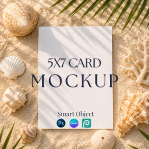 May include: A white 5x7 card mockup with the text 5X7 CARD MOCKUP and Smart Object printed in dark blue. The card features three small circular icons for Photoshop, Canva, and a third design tool, surrounded by various seashells on sand.