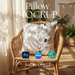 May include: A square pillow with a floral and abstract design, displayed on a wicker chair. The pillow has a white background with a grid pattern on one side. The text "Pillow MOCKUP" and "Smart Object" are visible.