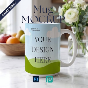 May include: A white ceramic mug featuring a graphic print of a light blue sky with white clouds and a green grassy hill. The text "YOUR DESIGN HERE" is printed in black on the front. The mug has a curved handle and a smooth, glossy finish.