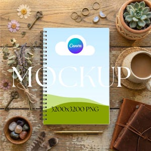 May include: A spiral-bound notebook mockup with a Canva logo on the cover, featuring a blue sky and green landscape design. The image includes decorative elements like keys, flowers, and a cup of coffee, set on a rustic wooden surface. The text "MOCKUP" and "3200x3200 PNG" are also visible.