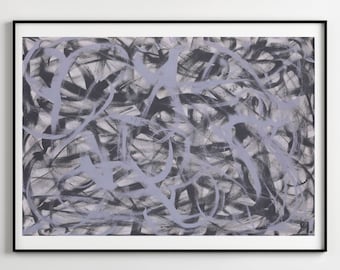 May include: A gray sofa with a black frame and a variety of throw pillows. The sofa is in front of a white wall with a framed abstract painting in black and gray tones.