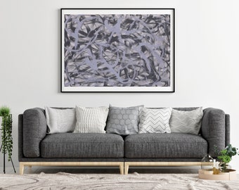 May include: A gray sofa with four pillows, a framed abstract painting with black and gray lines on a light purple background, a potted plant on a black stand, and a potted plant on a wooden tray with candles.