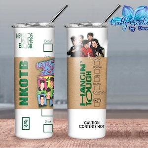 May include: A white 20 oz tumbler featuring the text "NEW KIDS ON THE BLOCK" and "NKOTB" in green. The tumbler has a brown band with the words "HANGIN' TOUGH" and a photo of the band. Includes a silver straw.