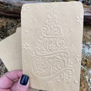 Lots of natural colored kraft paper Christmas bags, embossed for bank notes, show tickets, jewelry, etc.