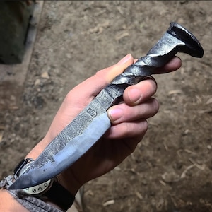 Rail road spike knife