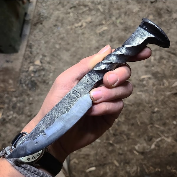 Rail road spike knife