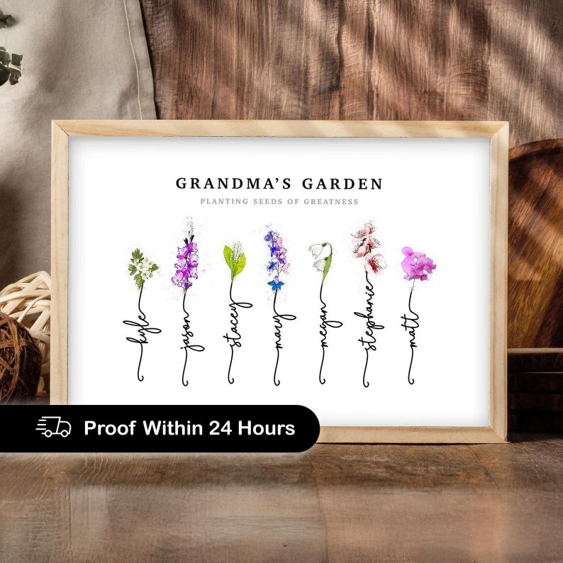 Grandmas Garden personalized birth flower print in a light wood frame, titled Grandma's Garden, Planting Seeds of Greatness. Seven watercolor birth month flowers (hawthorn, gladiolus, lily of the valley, larkspur, snowdrop, cherry blossom and sweet pea) grow from hand-lettered stems spelling each grandchild's name. Sentimental grandma gift and birth flower art from the grandkids.