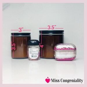 May include: Three glass jars with black lids. The jars are 3.5 inches tall and 3 inches wide. A small clear plastic bottle with a black lid is in front of the jars. The bottle is 4 inches tall. A pink and white glitter case is in front of the jars. The case is 3.5 inches wide. The text "Miss Congeniality" is in the bottom right corner of the image.