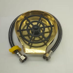 May include: A gold-colored metal sink sprayer with a black plastic wheel-shaped strainer and a braided hose.