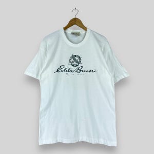 Vintage Y2K EDDIE BAUER t-shirt moyen Eddie Bauer extérieur Spellout Sportswear t-shirt Eddie Bauer en détresse blanc à manches courtes t-shirt taille M