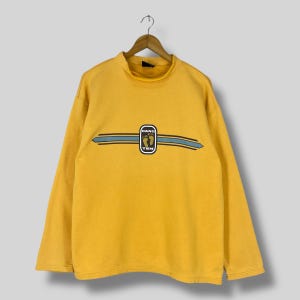 90年代ヴィンテージのHANG TENダメージ加工スウェットシャツ、ラージサイズのHANG TENスモールロゴプリント、HANG TENパイプラインビーチサーファーイエロークルーネックセーター、サイズL