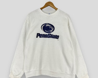 May include: White crewneck sweatshirt with a blue Penn State logo and the words "Penn State" printed on the front.