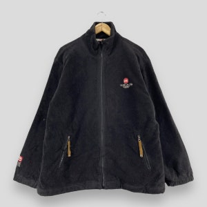 May include: A black fleece jacket with a zipper closure and two zippered pockets. The jacket has a stand-up collar and the logo "ECHO UNLTD" embroidered on the chest.