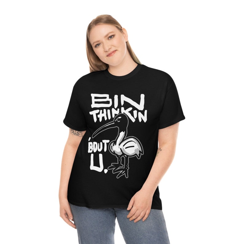 May include: Black t-shirt with a white graphic of a bird and the text "BIN THINKIN 'BOUT U."