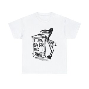 May include: White t-shirt with a black and white illustration of a bird holding a trash can. The trash can has the text "I like big bins and I cannot lie" printed on it.