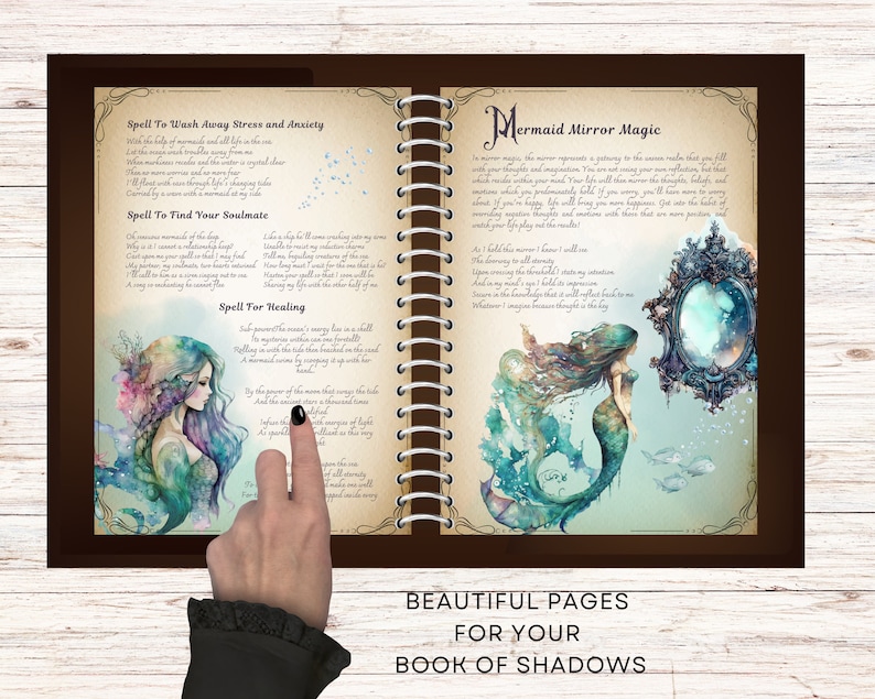 May include: Open book with brown cover and spiral binding. The pages are decorated with watercolor illustrations of mermaids and text. The text includes spells for finding your soulmate, washing away stress and anxiety, and healing. The book is titled "Mermaid Mirror Magic".
