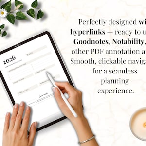 May include: A digital planner on a tablet, featuring a 2026 New Year's resolutions layout. The screen displays sections for goals, priorities, and things to try. Text on the screen reads "Perfectly designed with hyperlinks". A white stylus is held over the screen.
