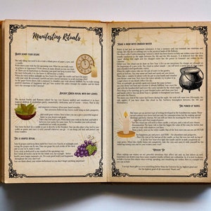 May include: An open book with yellowed pages and gold accents. The book is titled "Manifesting Rituals" and contains instructions for various rituals, including "Write Down Your Desire", "Ancient Green Ritual with Bay Leaves", "The 12 Grapes Ritual", "Make a Wish with Charged Water", and "The Power of Runes". Illustrations of a candle, a cauldron, grapes, and bay leaves are included.