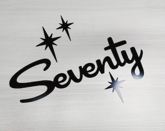 May include: Black cutout letters spelling "Seventy" with four black star shapes on a white wood background.