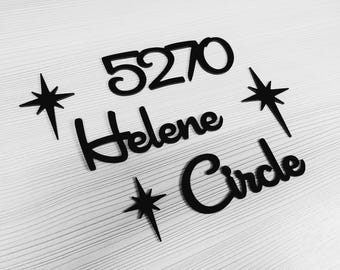 May include: Black cut-out house numbers and street name spelling out "Helene Circle" and the number "5270". The design includes starburst accents, all in a minimalist style.
