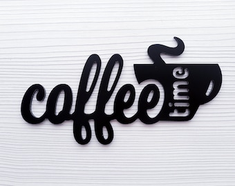 May include: Black metal wall decor with the words "coffee time" and a stylized coffee cup with steam.