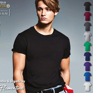 May include: A black t-shirt with short sleeves and a crew neck. The t-shirt is made from sustainable and organic materials. The t-shirt is available in a variety of colors, including grey, maroon, green, pink, blue, and yellow. The t-shirt is available in sizes up to 6XL. The t-shirt is certified by Oeko-Tex Standard 100 and is vegan.