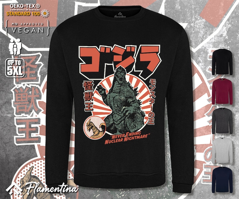 May include: Black long-sleeved sweatshirt featuring a graphic print of Godzilla, a Japanese monster, in front of a red sun. The text "ゴジラ" (Godzilla) is in Japanese characters above the monster. The text "怪獣王" (King of the Monsters) is to the left of the monster. The text "モンスターの王" (King of the Monsters) is to the right of the monster. The text "NEVER ENDING NUCLEAR NIGHTMARE" is below the monster.
