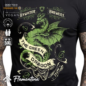 May include: Black t-shirt with a green dragon design and the words "The Green Dragon Inn". The shirt also features "Bywater Brewery" and "Flamentina". Made from organic cotton, available up to 5XL.